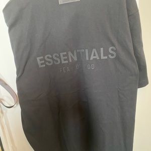 Fear of God ESSENTIALS black polo size medium never worn NWT